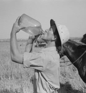 "Rice farmer drinking in the fields, Crowley, Louisiana" by Russell Lee, 1938